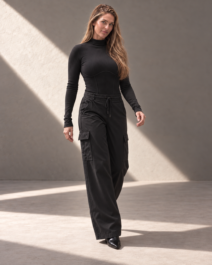 Kinetic Seamless Long Sleeve Top in black styled for movement with wide-leg cargo pants