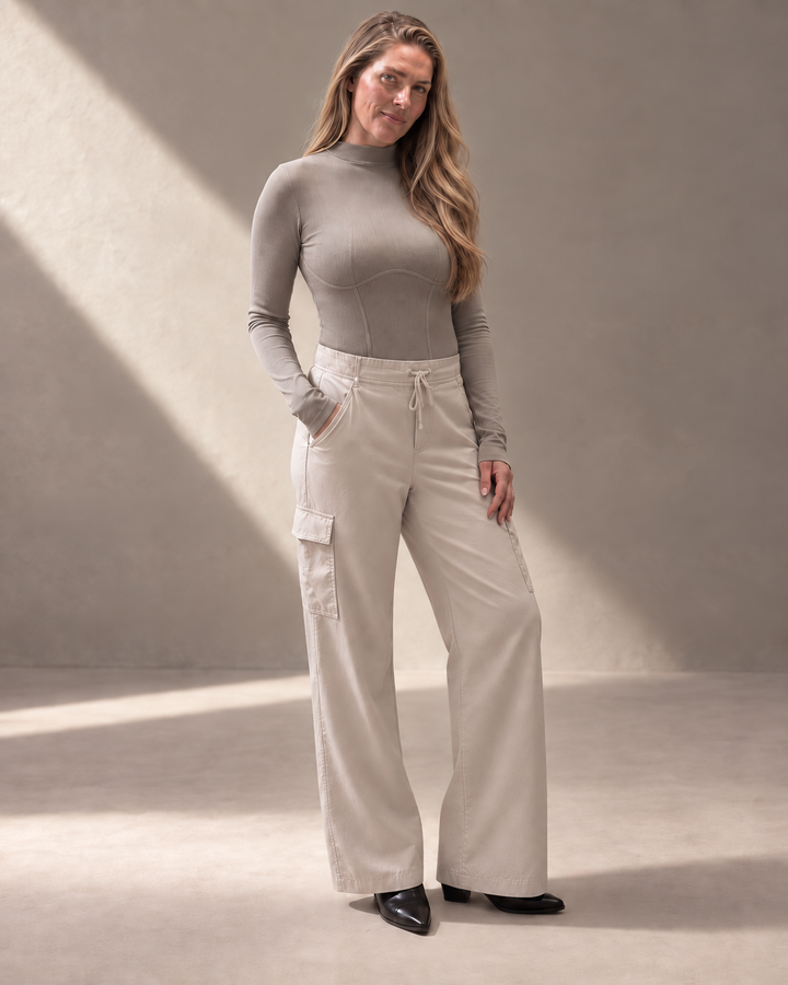Kinetic Seamless Long Sleeve Top in Satellite styled with beige wide-leg pants